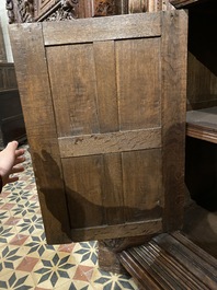 A rare German carved oak sculptural cupboard on diagonal supports with recumbent lions, Westphalia, 16th C.