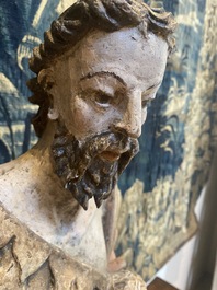 A large polychrome oak figure of John the Baptist, early 17th C.