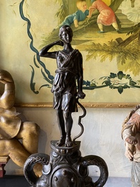 A pair of patinated bronze andirons with Greek gods, 19th C.