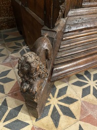 A rare German carved oak sculptural cupboard on diagonal supports with recumbent lions, Westphalia, 16th C.