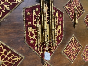 A Spanish walnut 'bargue&ntilde;o' cabinet with red velvet and bronze mounts, 17th C.