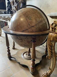 A celestial globe on a polychrome wooden base, 19th C.