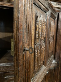 A rare German carved oak sculptural cupboard on diagonal supports with recumbent lions, Westphalia, 16th C.