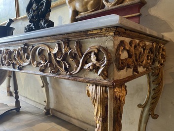 A pair of Italian patinated and gilt wooden wall consoles with marble top, 18th C.