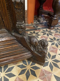 A rare German carved oak sculptural cupboard on diagonal supports with recumbent lions, Westphalia, 16th C.