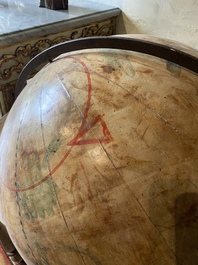 A celestial globe on a polychrome wooden base, 19th C.
