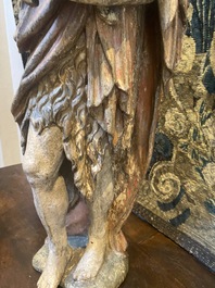 A large polychrome oak figure of John the Baptist, early 17th C.