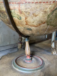 A celestial globe on a polychrome wooden base, 19th C.