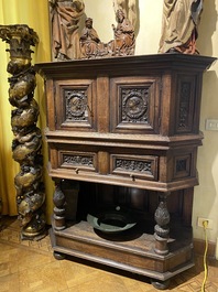 A walnut 'credence' case with portrait medallions, probably France, late 17th C. with later elements