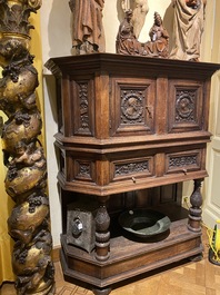 A walnut 'credence' case with portrait medallions, probably France, late 17th C. with later elements