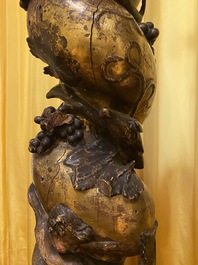 A pair of twisted and partly gilt wooden columns with birds and grapevines, prob. Italy, 17/18th C.