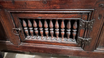 A Flemish carved oak two-door and two-drawer buffet with the Passion Instruments, dated 1691