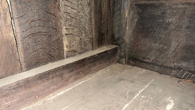 A Flemish carved oak two-door and two-drawer buffet with the Passion Instruments, dated 1691