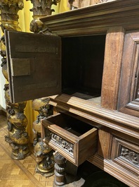 A walnut 'credence' case with portrait medallions, probably France, late 17th C. with later elements