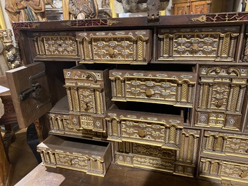 A Spanish walnut 'bargue&ntilde;o' cabinet with red velvet and bronze mounts, 17th C.