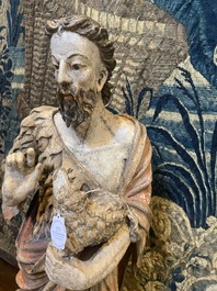 A large polychrome oak figure of John the Baptist, early 17th C.