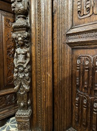 A rare German carved oak sculptural cupboard on diagonal supports with recumbent lions, Westphalia, 16th C.