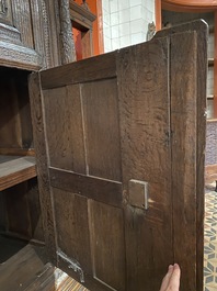 A rare German carved oak sculptural cupboard on diagonal supports with recumbent lions, Westphalia, 16th C.