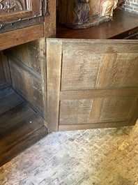 A rare large Flemish oak four-door cupboard with carved X-panels and wrought iron mounts, 1st half 16th C.