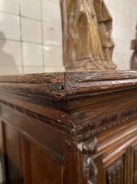 A rare German carved oak sculptural cupboard on diagonal supports with recumbent lions, Westphalia, 16th C.