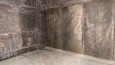 A Flemish carved oak two-door and two-drawer buffet with the Passion Instruments, dated 1691