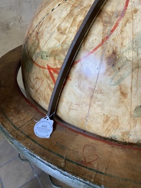 A celestial globe on a polychrome wooden base, 19th C.