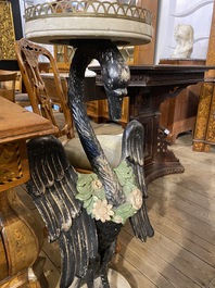 A pair of large polychromed wooden plant stands in the shape of swans with floral wreaths, ca. 1900