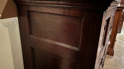 A Flemish carved oak two-door and two-drawer buffet with the Passion Instruments, dated 1691