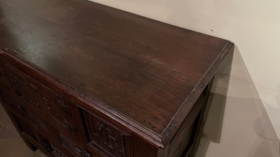 A Flemish carved oak two-door and two-drawer buffet with the Passion Instruments, dated 1691