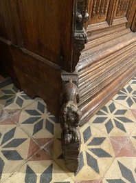 A rare German carved oak sculptural cupboard on diagonal supports with recumbent lions, Westphalia, 16th C.