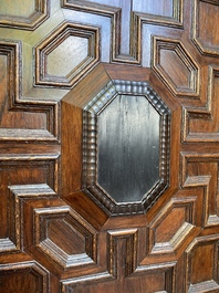 A Flemish ebonised and oak wooden four-door cabinet, 17th C.