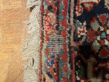 A large rectangular ornamental Heriz rug, 19/20th C.