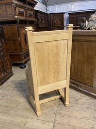 A French Gothic Revival white oak wooden armchair, 20th C.