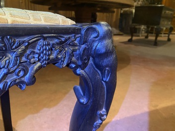 An Anglo-Indian colonial carved wooden sofa with two matching chairs, late 19th C.