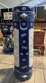 A large blue and white Arita porcelain cylindrical vase or umbrella stand with molded design, Japan, Meiji, 19th C.