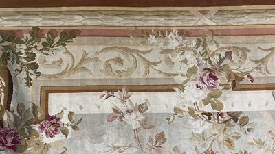 A large French Aubusson rug with floral design and landscapes, 19th C.