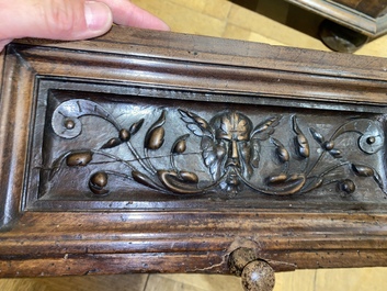 A walnut 'credence' case with portrait medallions, probably France, late 17th C. with later elements