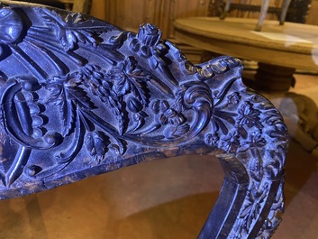 An Anglo-Indian colonial carved wooden sofa with two matching chairs, late 19th C.