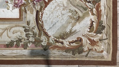 A large French Aubusson rug with floral design and landscapes, 19th C.