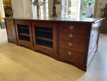 An English neoclassical leather-topped mahogany library desk with gilt bronze mounts, 19th C.