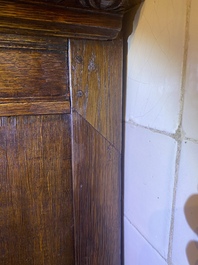 A rare German carved oak sculptural cupboard on diagonal supports with recumbent lions, Westphalia, 16th C.