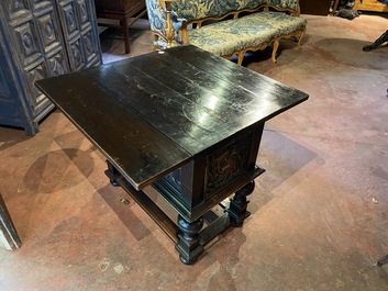 A rare ebonised wooden baluster leg table with polychromed reliefs, 17th C. with later elements