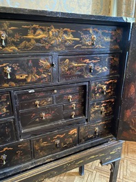 An English lacquered and painted chinoiserie cabinet on stand, 19th C.