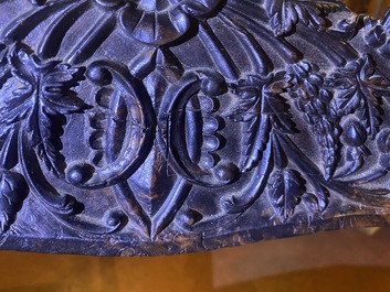 An Anglo-Indian colonial carved wooden sofa with two matching chairs, late 19th C.