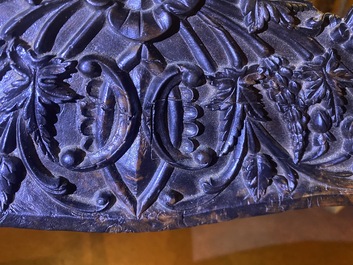 An Anglo-Indian colonial carved wooden sofa with two matching chairs, late 19th C.