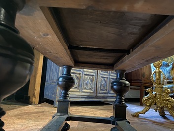 A rare ebonised wooden baluster leg table with polychromed reliefs, 17th C. with later elements