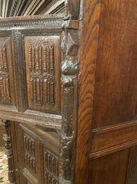 A rare German carved oak sculptural cupboard on diagonal supports with recumbent lions, Westphalia, 16th C.