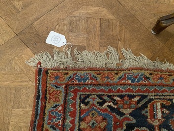 A large rectangular ornamental Heriz rug, 19/20th C.