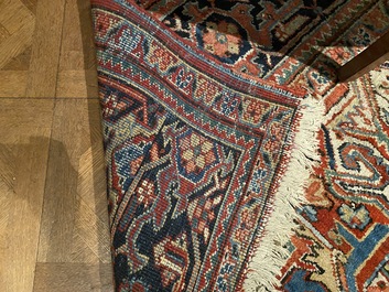 A large rectangular ornamental Heriz rug, 19/20th C.