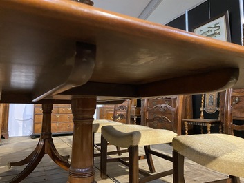 A large English mahogany dining table, 20th C.